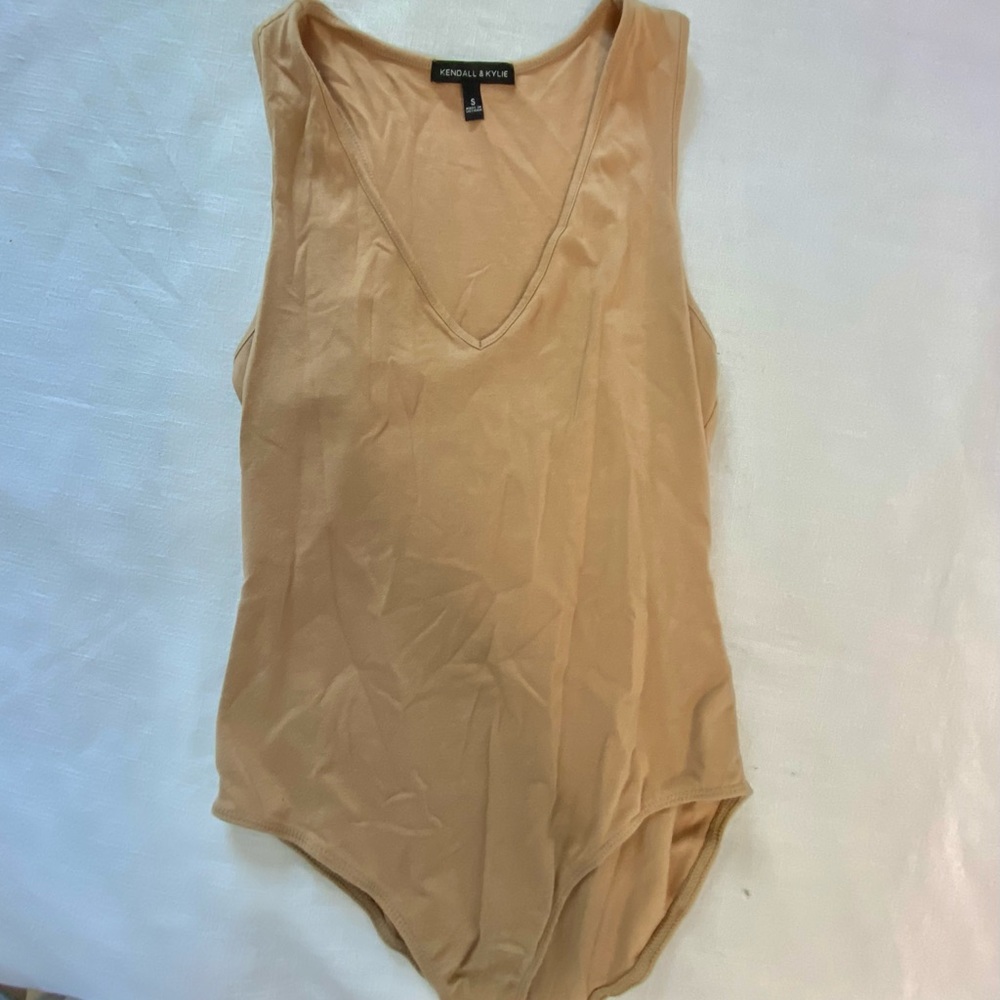 tan body suit